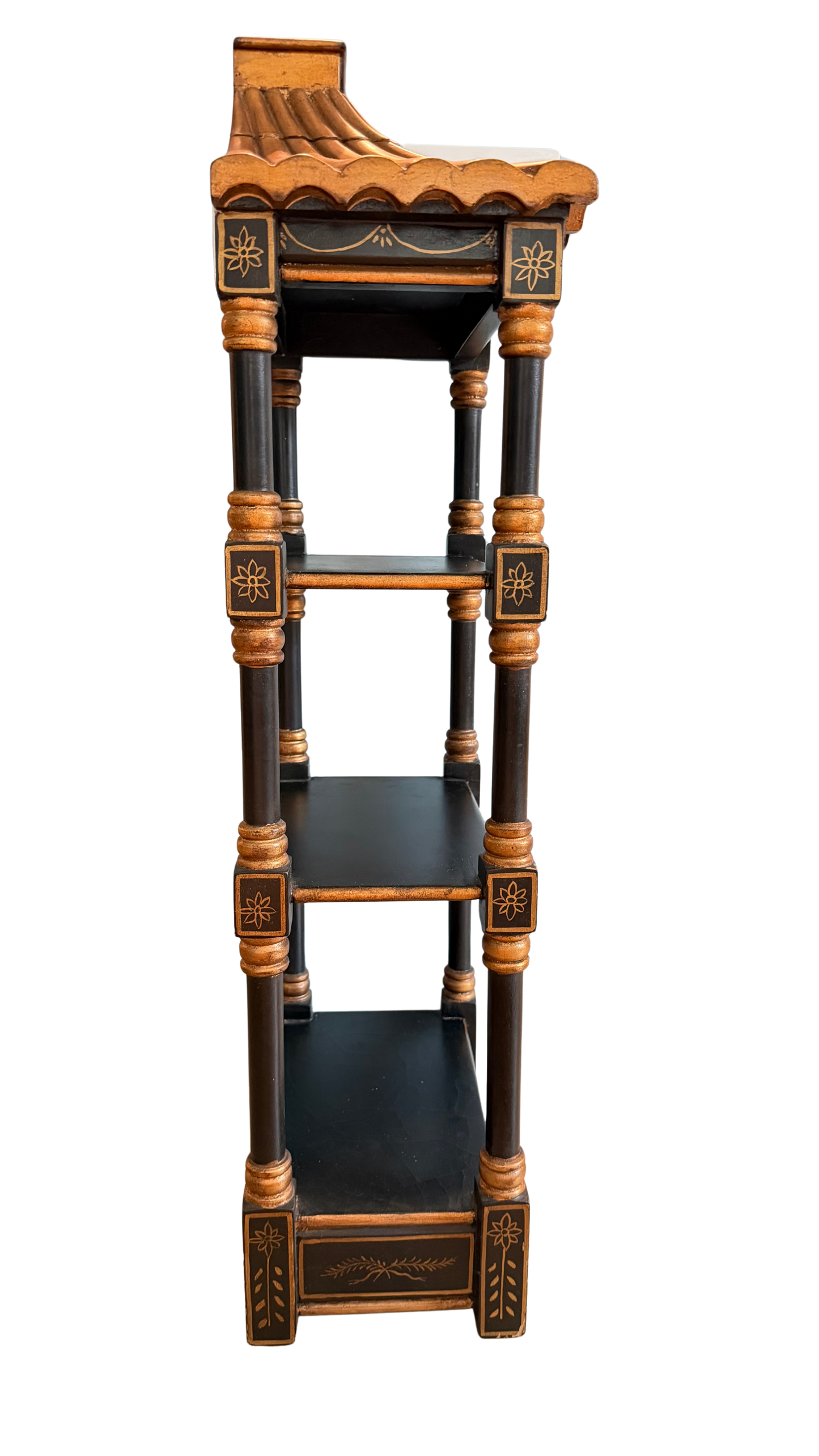 Right-side view of vintage black and gold pagoda wall shelf showing narrow depth and three display tiers.