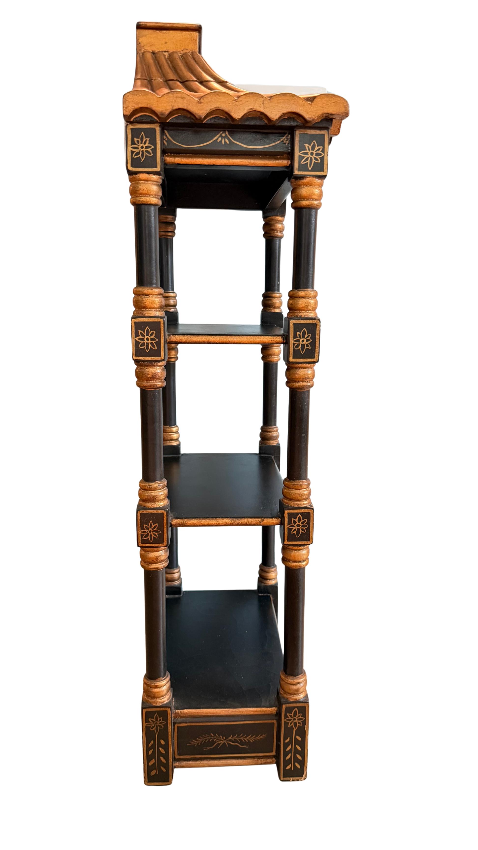 Right-side view of vintage black and gold pagoda wall shelf showing narrow depth and three display tiers.