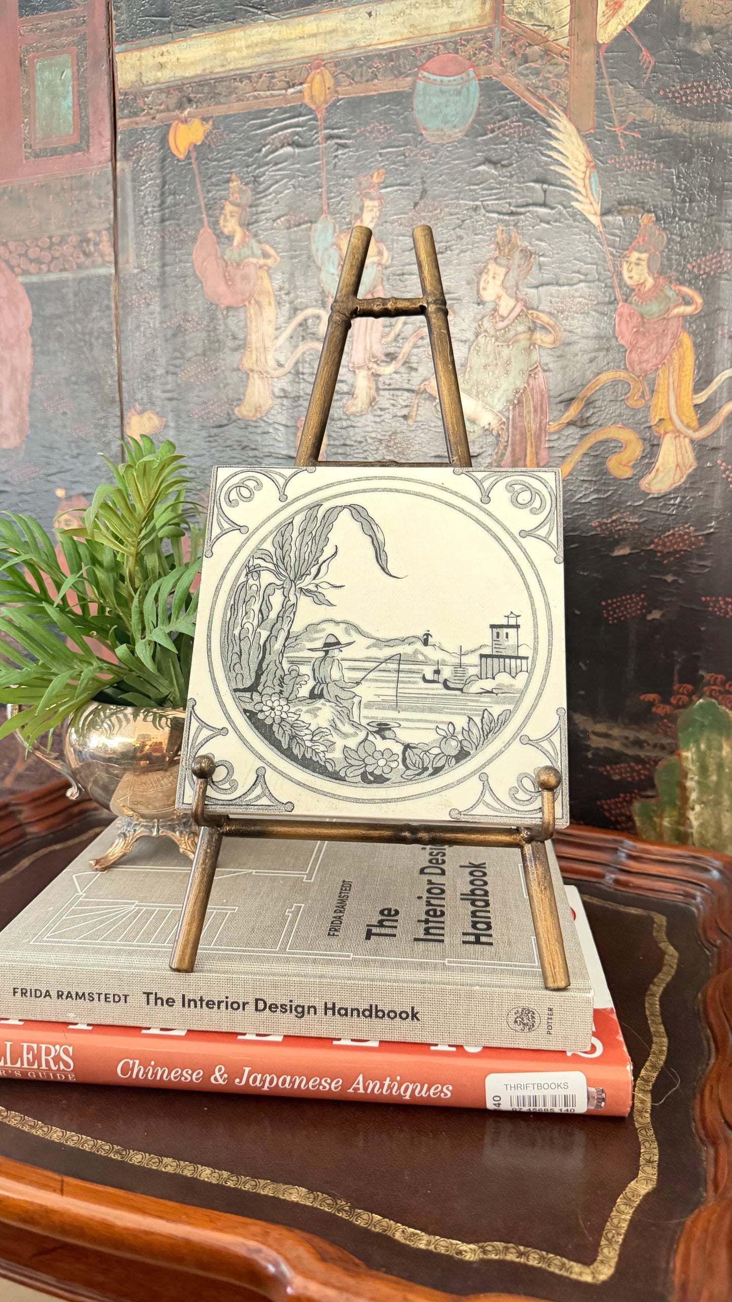 Antique Minton black transferware Chinoiserie fishing tile displayed on a brass easel