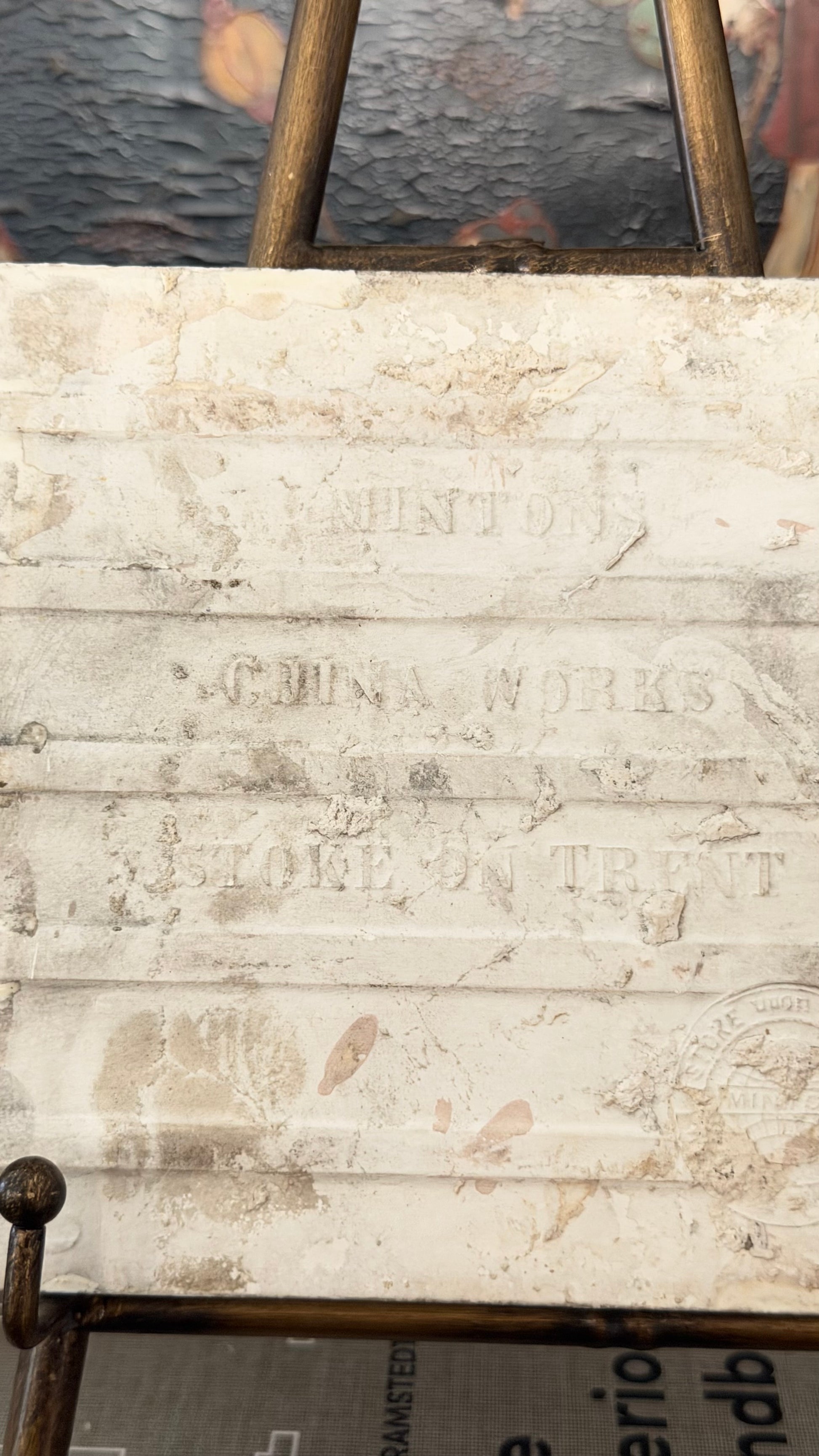 Reverse of antique Minton black transferware ceramic tile