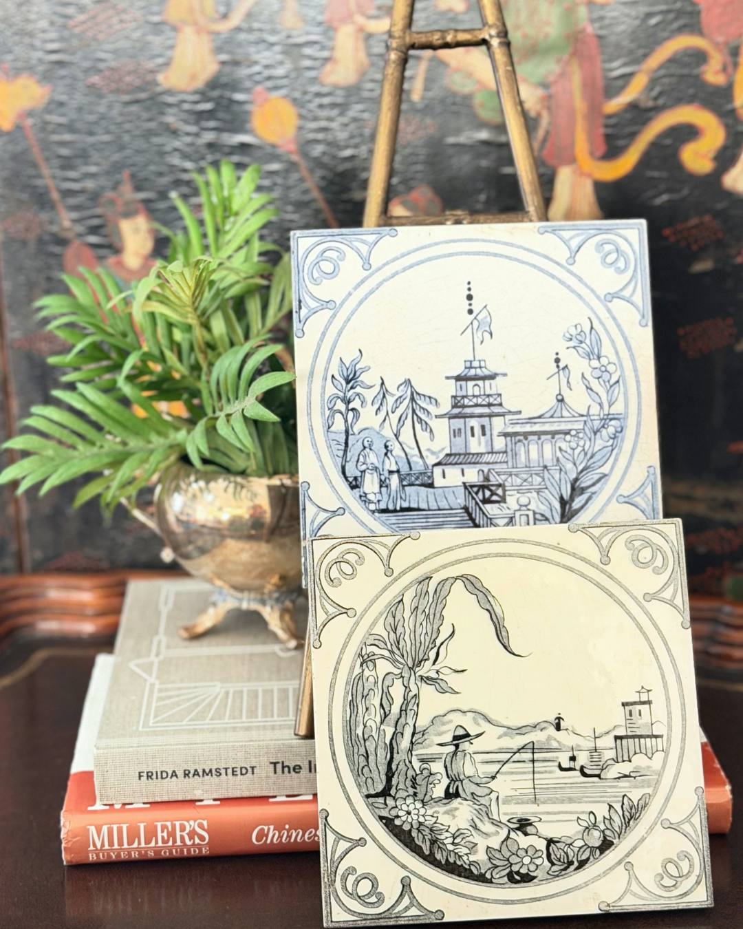 Blue-and-white and black transferware Minton Chinoiserie tiles styled together on a Maitland-Smith table