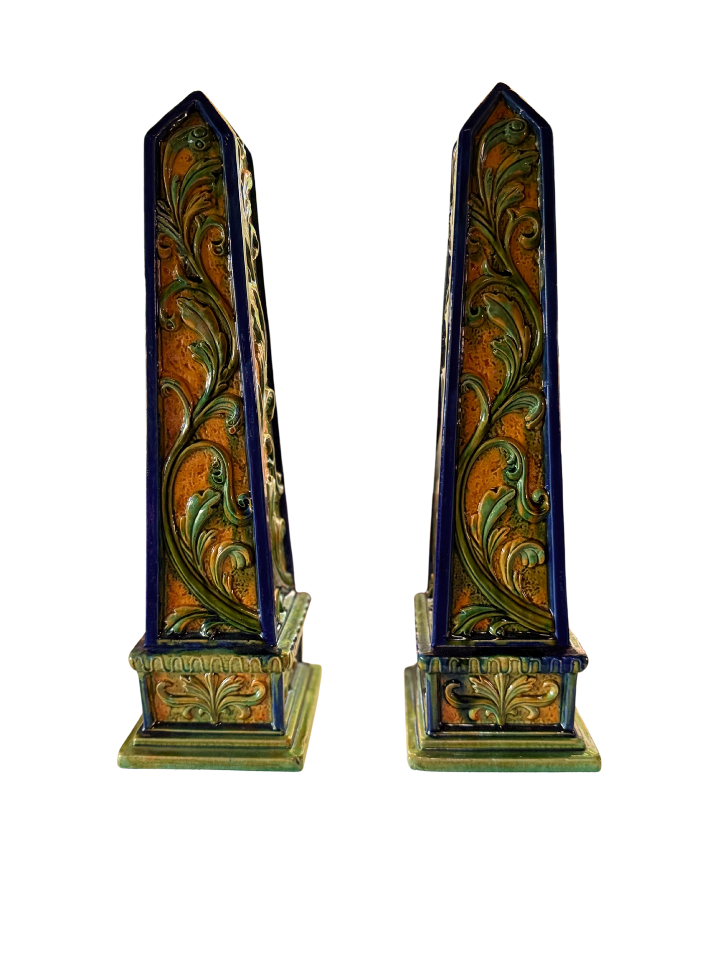 Pair of vintage Italian glazed terracotta foliate obelisks in green, ochre, and cobalt blue.
