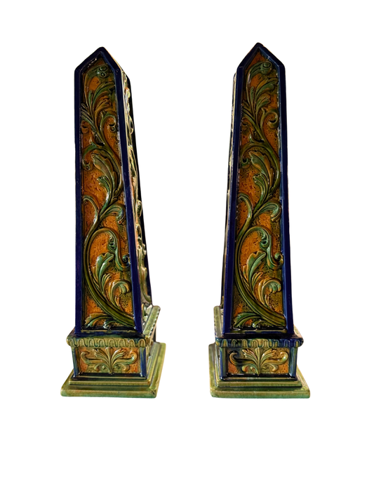 Pair of vintage Italian glazed terracotta foliate obelisks in green, ochre, and cobalt blue.