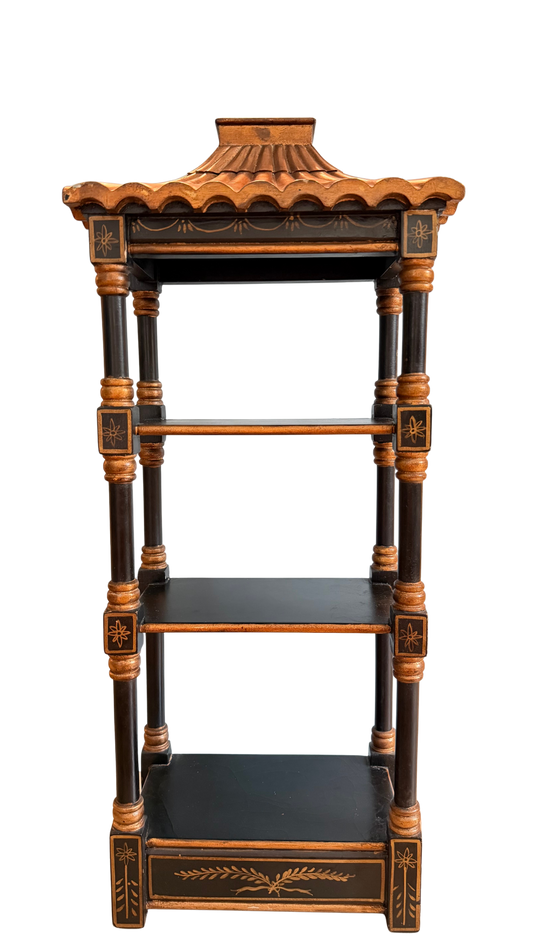 Vintage black and gold chinoiserie pagoda wall shelf with three tiers and turned supports.