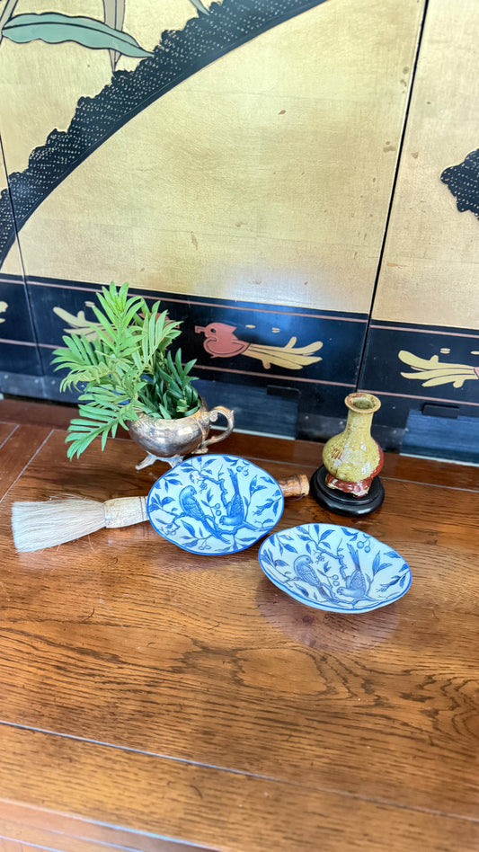 Vintage blue and white porcelain trinket dish with two birds perched among flowering branches